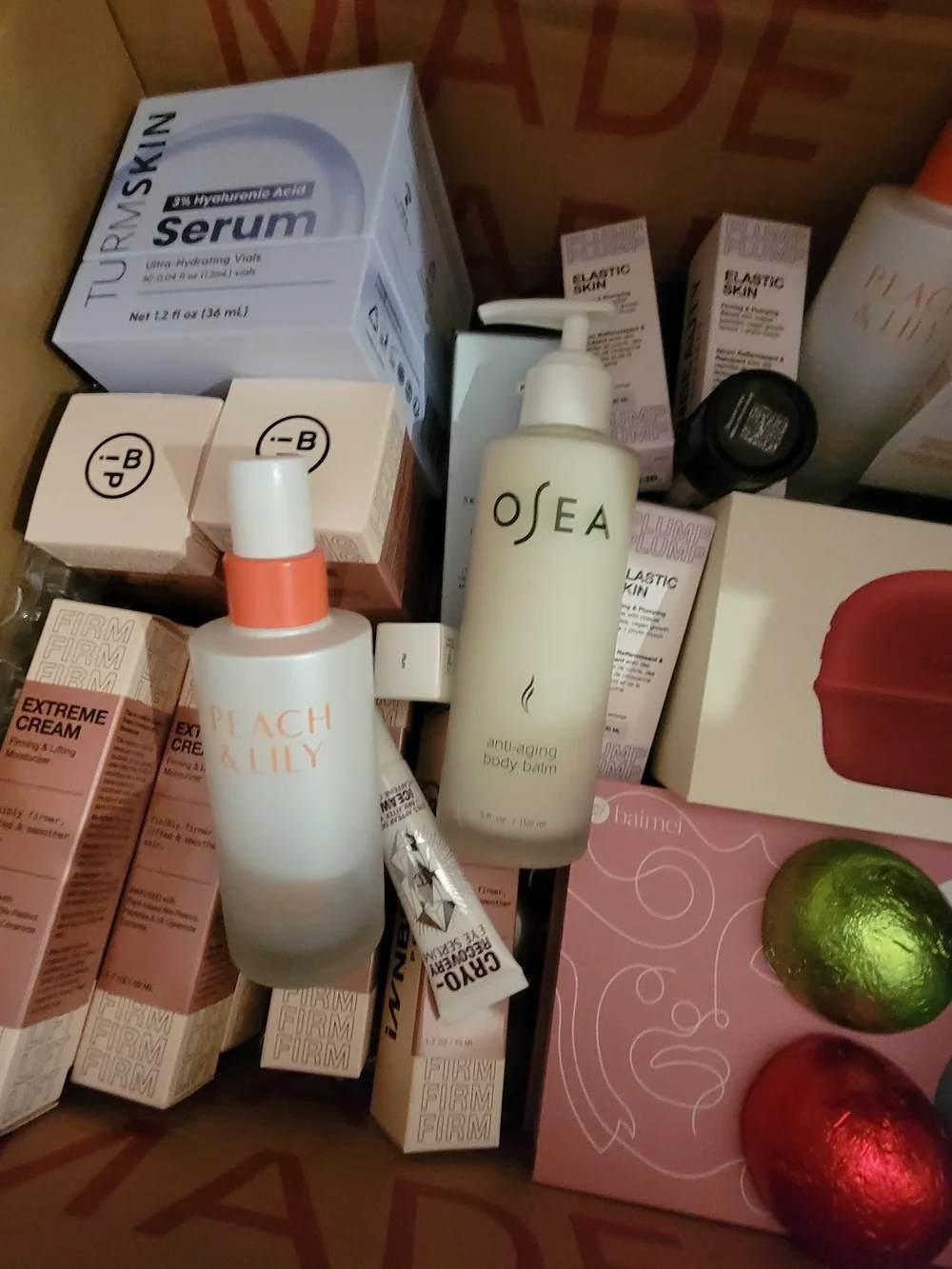 A Box Full Of Many High End Facial Items & Women's 8 Piece White Makeup Brushes